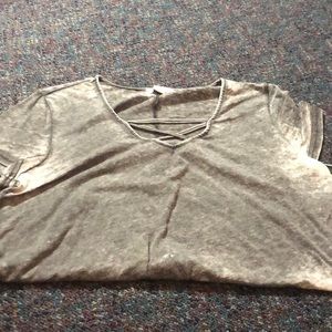 discolored gray top with cross in front